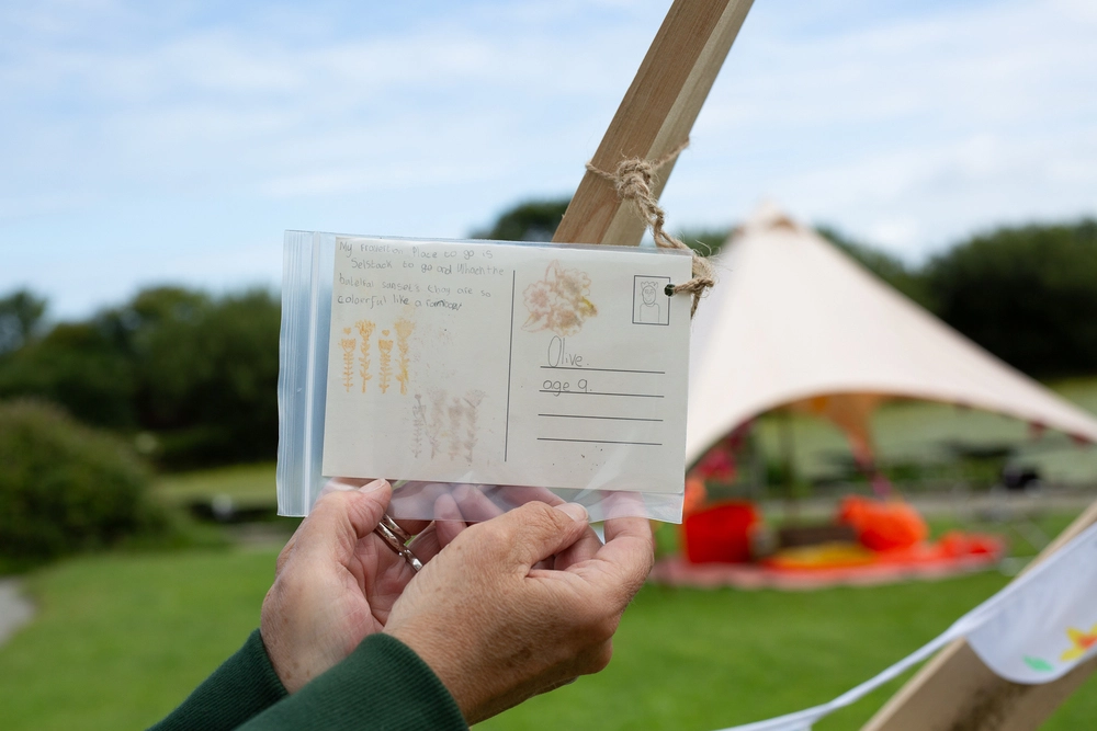 Back of postcard by , age 