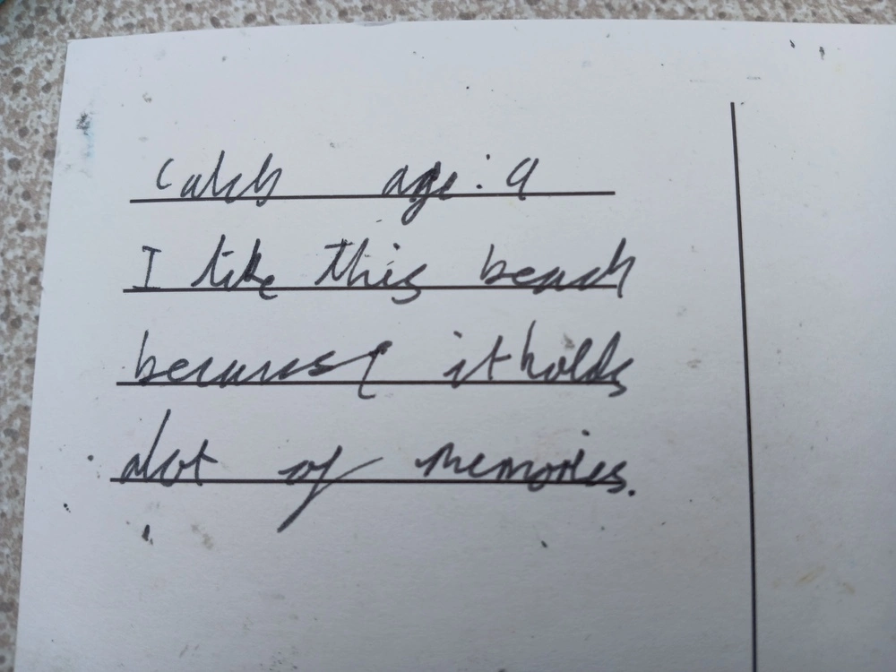 Back of postcard by , age 