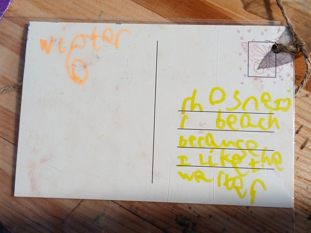 Back of postcard by , age 