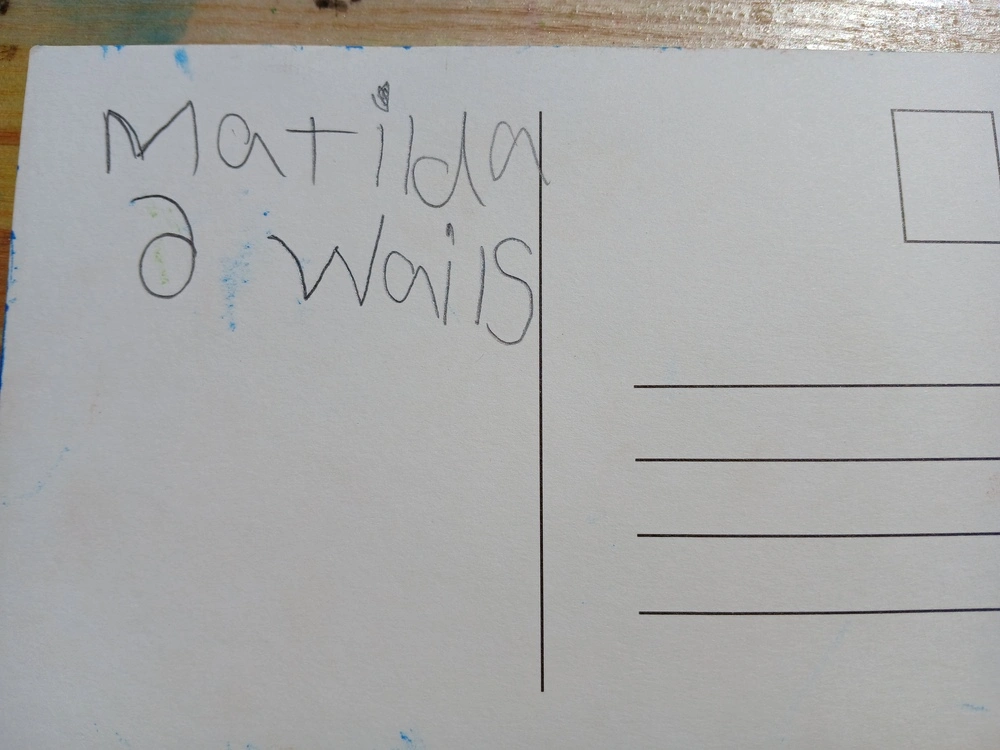 Back of postcard by , age 